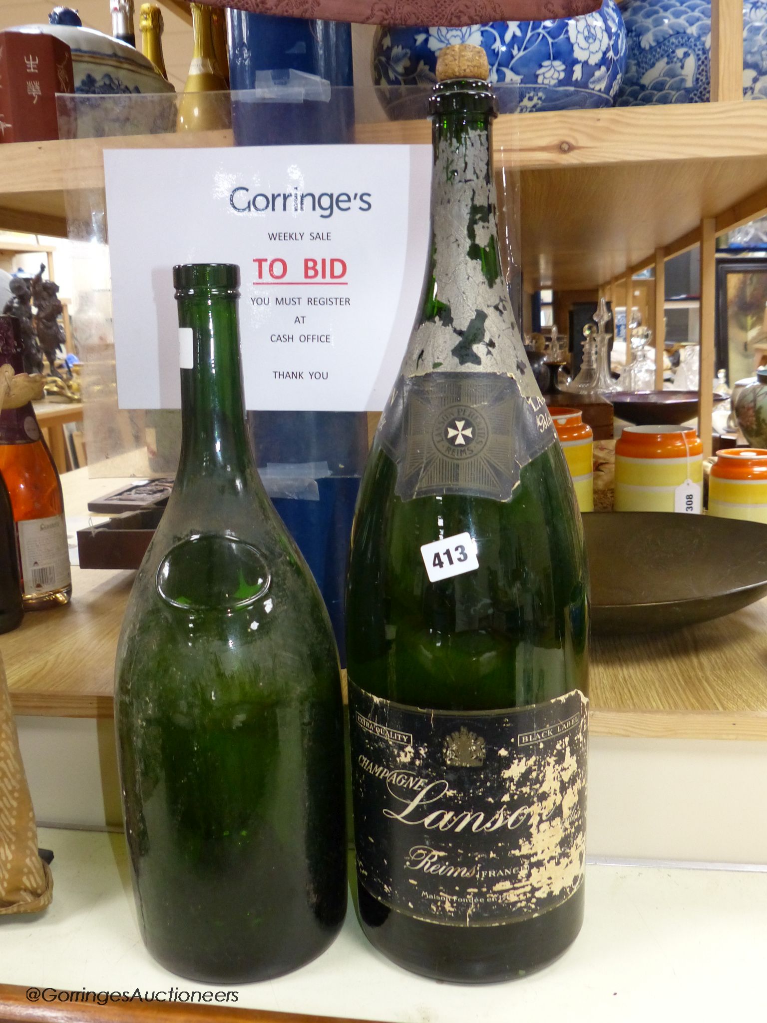Two large wine / champagne empty bottles, tallest 60cm